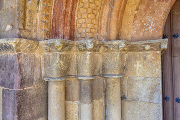 Romanesque column capitals with plant motifs in Verga?o church portal