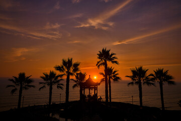 serene sunset at the Parque Chino (Chinese Park) in Miraflores, Lima. The park, inaugurated in 2022 to celebrate the bicentennial of Peru's independence and the long-standing friendship between Peru a