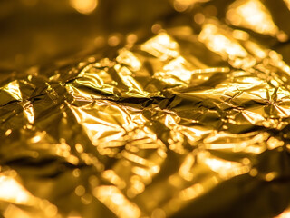 Abstract golden material texture with reflective surface