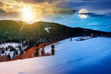 beautiful winter landscape with snow covered hills. day and night time change concept. serene rural scene in mountains with sun and moon. rolling countryside area. duality and transition template