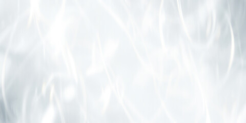 A bright and clean abstract background with soft, flowing white light and caustic reflections. A...