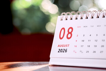 Calendar page of August 2026 on desk, with copy space. monthly planning concept, important schedules, meetings, and appointments.