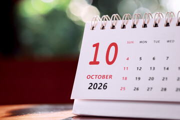 Calendar page of October 2026 on desk, with copy space. monthly planning concept, important schedules, meetings, and appointments.