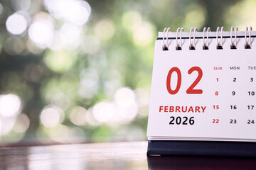 Calendar page of February 2026 on desk, with copy space. monthly planning concept, important schedules, meetings, and appointments.