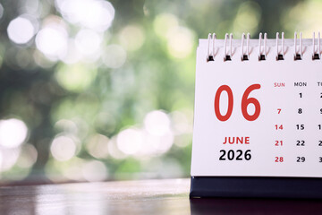 Calendar page of June 2026 on desk, with copy space. monthly planning concept, important schedules, meetings, and appointments.
