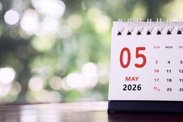 Calendar page of May 2026 on desk, with copy space. monthly planning concept, important schedules, meetings, and appointments.