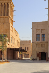 Dubai, Arab Emirates - 26. September 2025: Traditional wind towers and buildings in Old Town Dubai