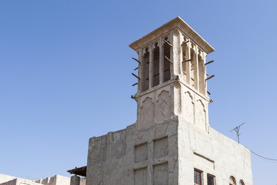 Dubai, Arab Emirates - 26. September 2025: Dubai old town barjeel windcatcher against blue sky