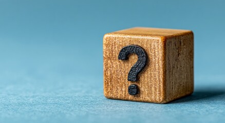 Wooden cube with question mark, representing customer service and communication,