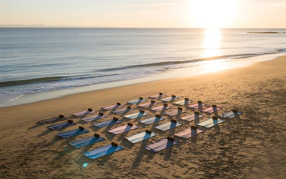 Sunset beach yoga class with colorful mats