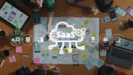 A dynamic workspace scene showcasing a team collaborating on software development, utilizing digital tools, notes and brainstorming ideas next to coffee cups. Raster