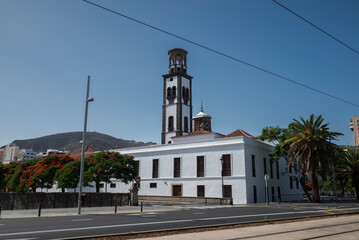 Historic Church of the Immaculate Conception in Santa Cruz de Tenerife, Tenerife, Spain, featuring a distinctive bell tower and white facade under a clear blue sky
