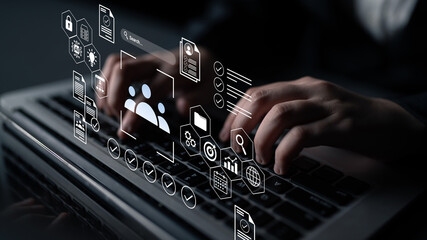 Hands typing on a keyboard with digital icons representing data management and technology concepts, illustrating modern digital interaction and workflow processes. Gantry