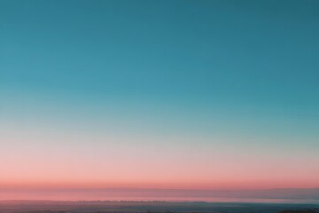 Open horizon at blue hour showcases a soft gradient of pastel colors blending seamlessly, creating a tranquil atmosphere with expansive skies and serene landscapes