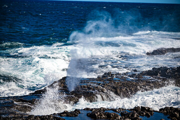 Sunrise Bufadero water blasting into the air on the coast of Gran Canaria in the Canary Islands