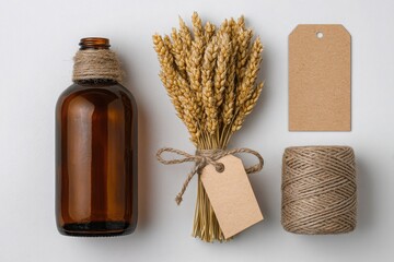 Natural amber glass bottle with wheat stalks twine and craft tags on white background