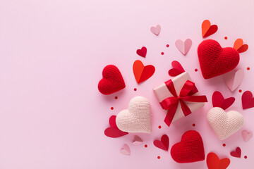 Valentine day gift box decorated with pink and red love hearts top view. Beautiful festive...
