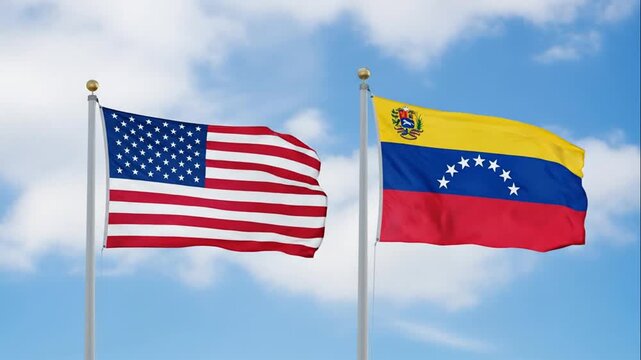 United States and Venezuela National Flags Flying in the Breeze Against a Bright Sky