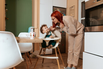Mother and Son Enjoying a Quiet Moment in the Kitchen