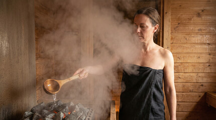 Women engage in sauna ritual for wellness and connection in natural setting during their self-care moment