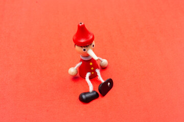 Old Pinocchio wooden doll of fairy tale character