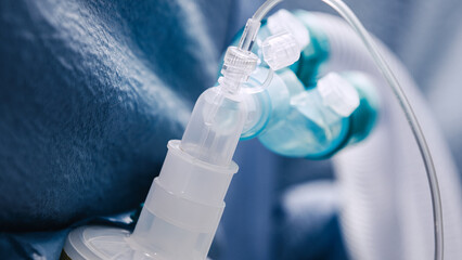 Medical equipment in an operating room, featuring a close-up of anesthesia apparatus, showcasing intricate details and sterile environment for surgical procedures