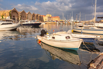 Docked sailing yachts in the Venetian Harbor in Chania, Crete, Greece with cloudy sky