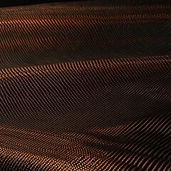 Close-up of a textured, shimmering fabric with a dark, metallic weave pattern, reflecting light.