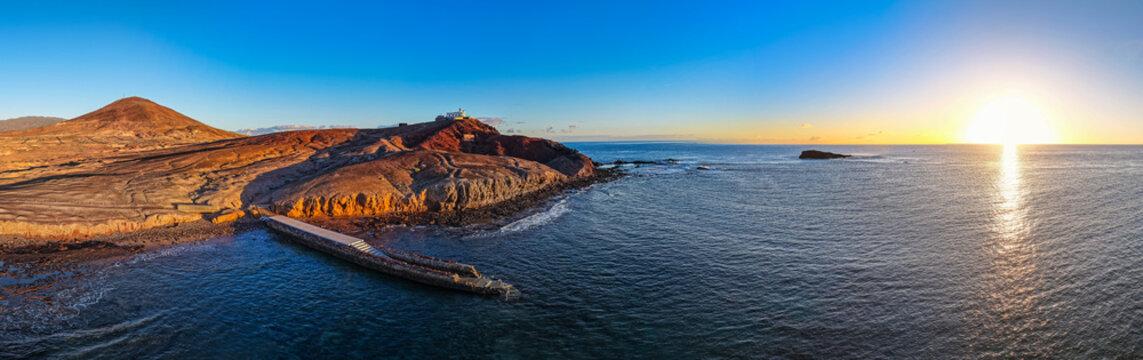 Aerial view of the Muelle Viejo Swimming Platform and Tidal Sunbathing Deck on the Volcanic Shoreline of Arinaga, Gran Canaria, Spain	