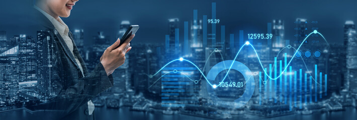A confident businesswoman interacts with a smartphone showcasing financial graphs. The city skyline glows at night, representing modern technology and analysis. Scalp
