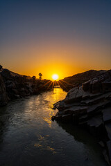 Sunsets over Kunene River scenery between Angola and Namibia, Southern Africa