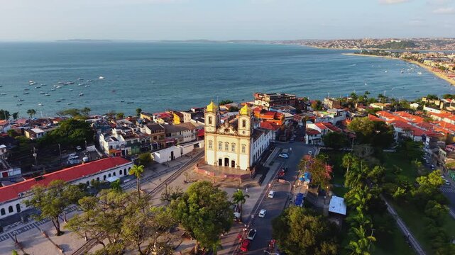 A golden-hour aerial reveals a Church of Nosso Senhor do Bonfim (Igreja de Nosso Senhor do Bonfim), one of the most famous and important Catholic churches in Salvador, Bahia, Brazil.  