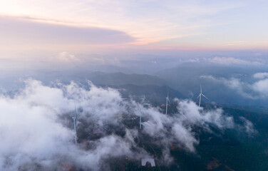 Fototapeta premium Wind generators amidst cloudy landscape Renewable energy