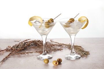 Cocktail Drinks With Olives and Lemon on a Light Background
