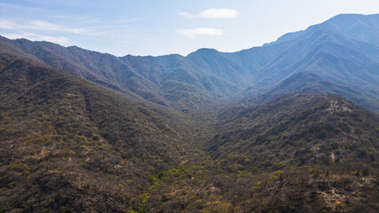 Naklejka premium Mountain landscape of Mayascón rising above rural valleys in Lambayeque, Peru