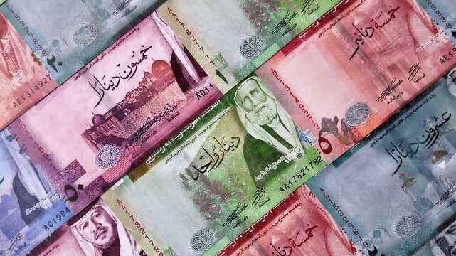 Jordan money, the Jordanian dinar currency, banknotes of various denominations, financial transactions. Jordanian money, the dinar as a financial background for your design
