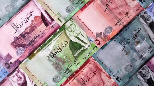 Jordan money, the Jordanian dinar currency, banknotes of various denominations, financial transactions. Jordanian money, the dinar as a financial background for your design