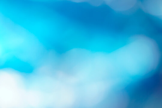 Fondo abstracto azul con luz oce&aacute;nica, arte vectorial, suaves ondas bokeh y texturas brillantes