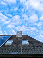 Fototapeta premium Solar panels generating clean energy on residential roof