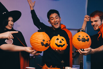 Friends enjoying a Halloween party at a bar making a toast