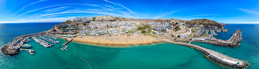  Aerial of People Relaxing at Luxury Cliffside Resorts Overlooking Puerto Rico Marina and the Atlantic Coastline, Gran Canaria, Spain © Mike Workman