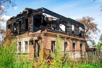 burned down two-story building The aftermath of a severe fire. A charred building floor. For fire safety articles, insurance claim illustrations, abandoned rural architecture, ruined building