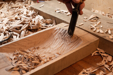 The master hollows out the extra wood in the billet for the tagelharpa