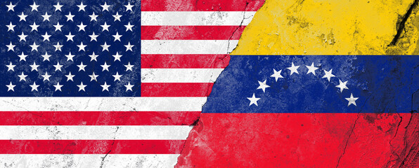 Flags of the United States and Venezuela on a cracked concrete wall representing diplomatic...