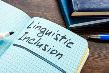 Linguistic inclusion written in a notebook. Diversity and equitable communication.