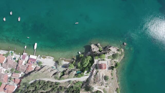 Panoramic aerial view of church of St. John at Kaneo and beach situated in Ohrid, Macedonia. Lake Ohrid with transparent clear turquoise water good for diving. UNESCO World Heritage List.