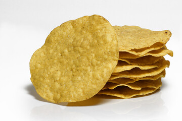 Several whole crunchy Tostados on white background
