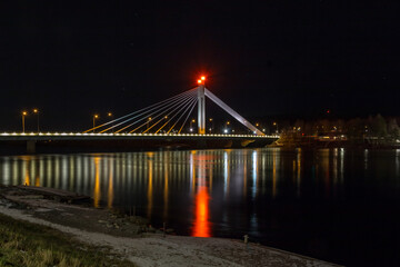 The famous Lumberjack's Candle Bridge over Kemijoki river in Rovaniemi, Finland in night time.