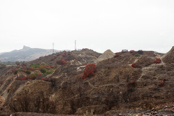Calanchi are unique 'badlands' in Basilicata, Italy, formed by white clay erosion in the area surrounding the ghost town, Craco.