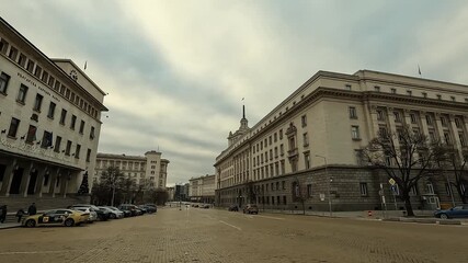 Handheld video filmed on January 1, 2026, showing a calm scene in front of major institutions in central Sofia, including the Bulgarian National Bank, Presidency, Council of Ministers, 01 Jan. 2026